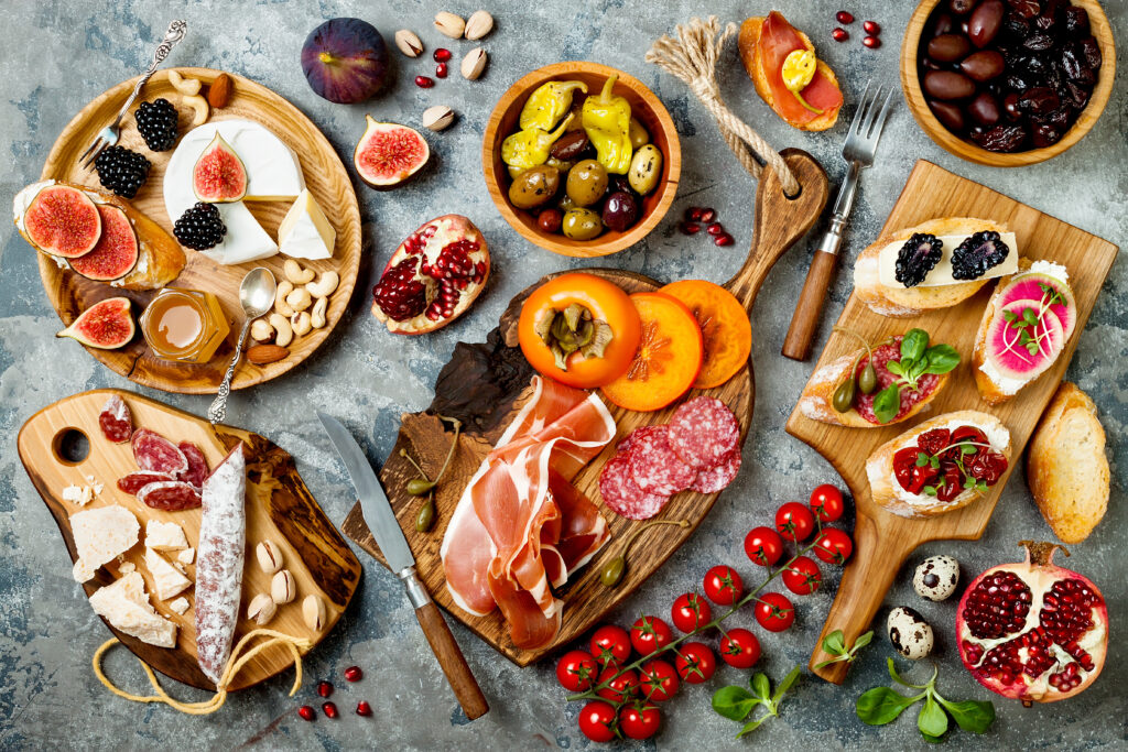 Charcuterie Board with Assorted Cheese, Grapes, and Wine